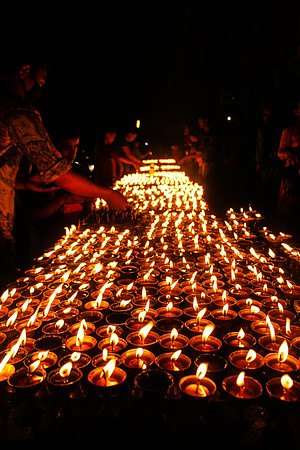 Lighting candles at Boudhanath Stupa, Kathmandu, Nepal 2 25-24