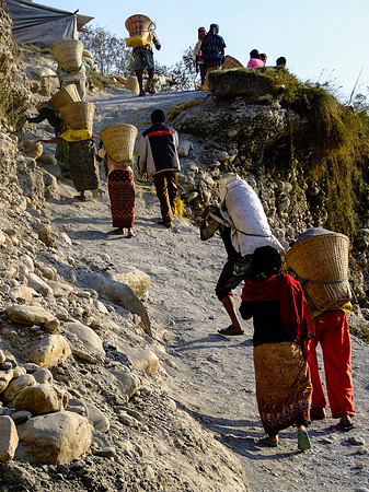 River miners carrying sacks