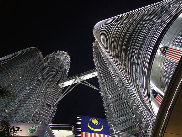 Petronas towers with a Malaysian flag