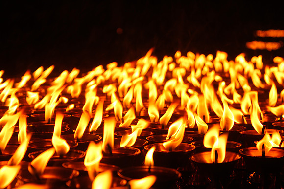 Row of yak butter candles Boudhanath Stupa, Kathmandu, Nepal 5-5